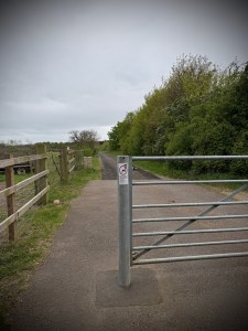 Space next to gate at the beginning of the path
